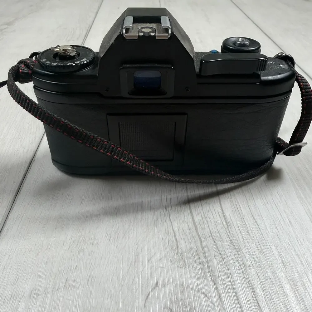 Nikon EM 35mm Film SLR Camera Body, Black (Body Only) for parts or repair